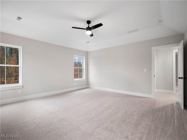 empty room with light carpet and ceiling fan