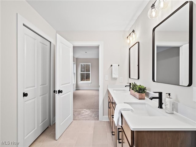 bathroom with tile patterned flooring and vanity