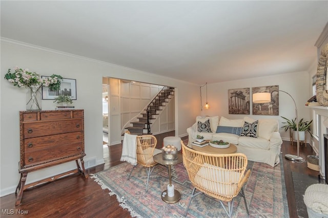 living room featuring crown molding and dark wood-type flooring