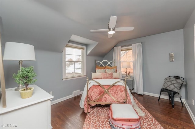 bedroom with dark hardwood / wood-style flooring, ceiling fan, and lofted ceiling