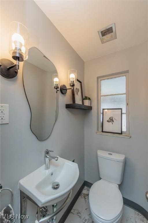 bathroom with toilet and sink