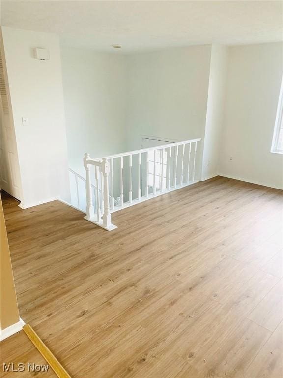 unfurnished room with light hardwood / wood-style flooring