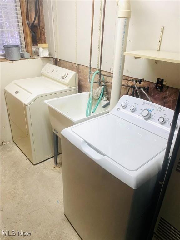 laundry area featuring washing machine and clothes dryer