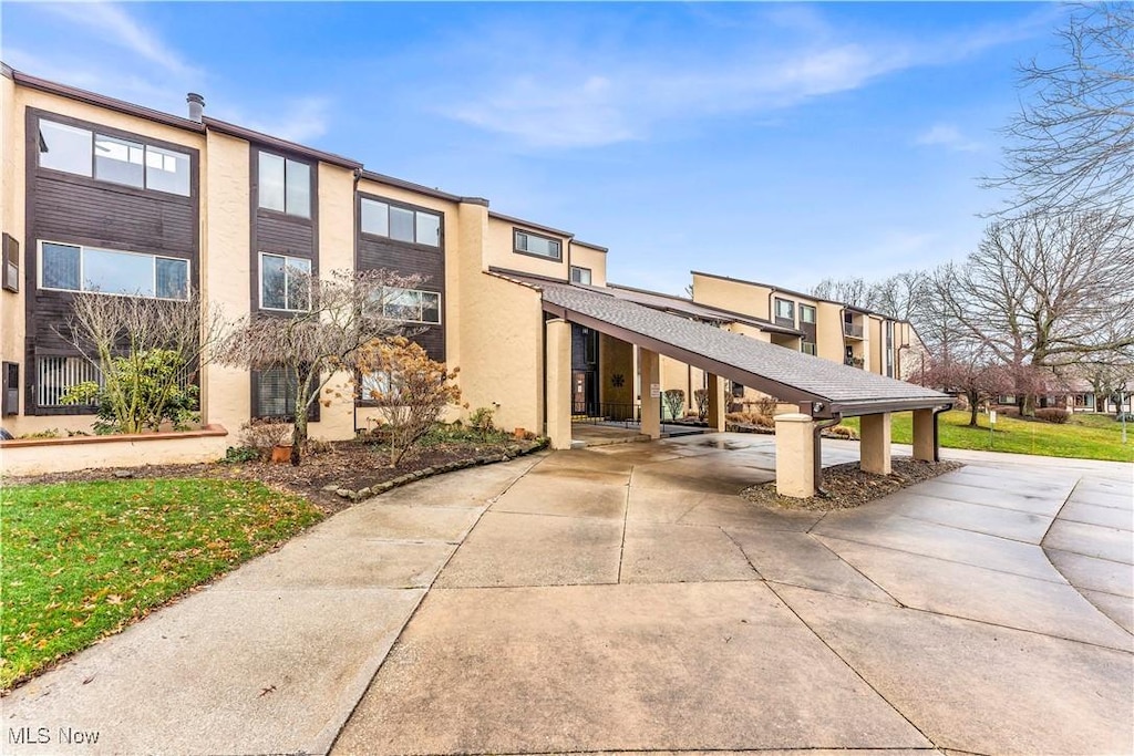 view of building exterior featuring a carport