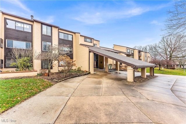 view of building exterior featuring a carport