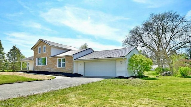 view of front facade with a garage and a front lawn