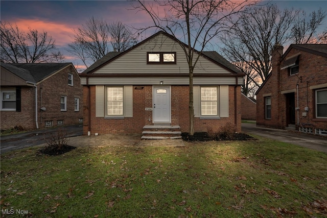 view of front of property with a lawn