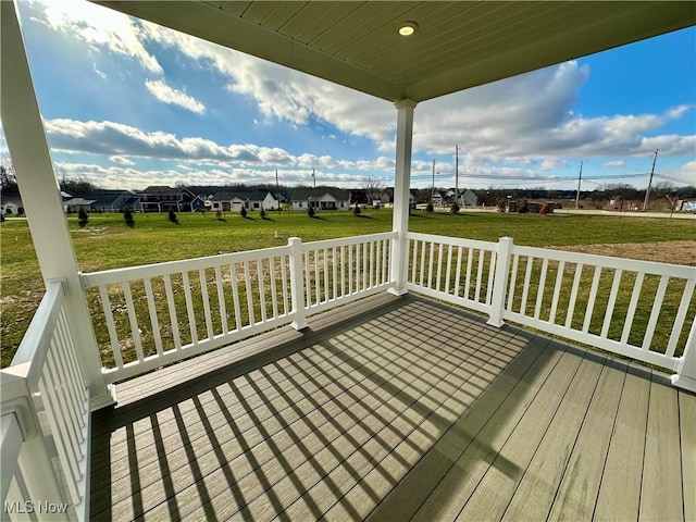 wooden deck with a yard