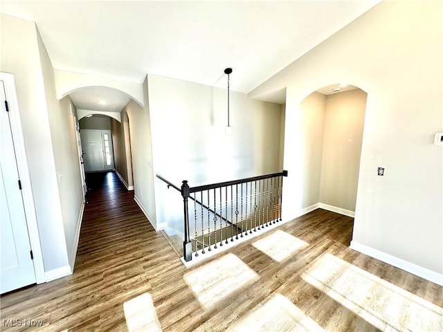 corridor featuring hardwood / wood-style floors