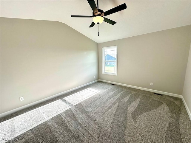 empty room with carpet floors, ceiling fan, and lofted ceiling