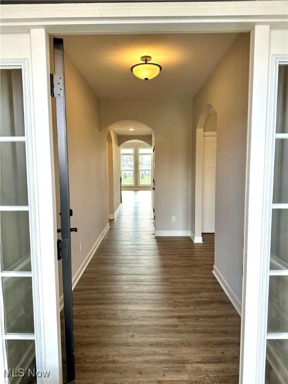 hall with dark hardwood / wood-style flooring