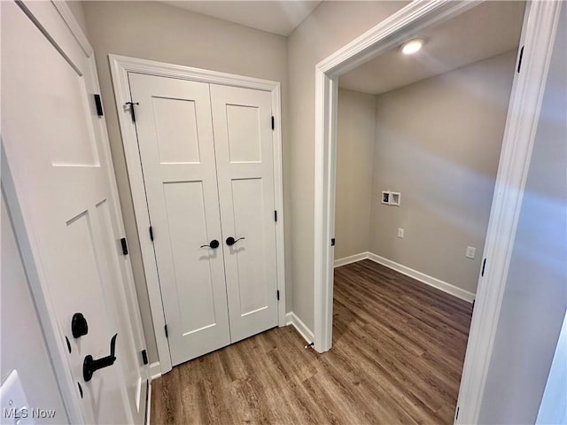 corridor featuring hardwood / wood-style floors