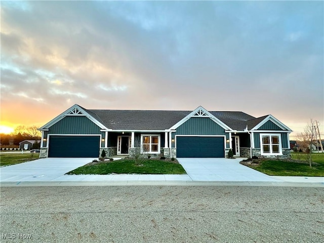 craftsman inspired home with covered porch and a garage