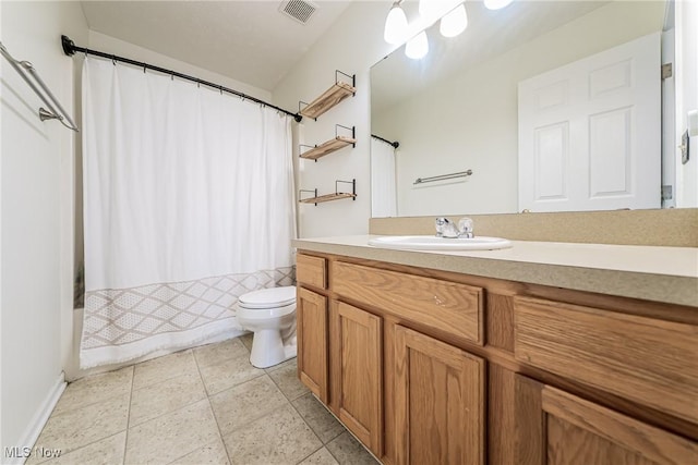 full bathroom featuring tile patterned floors, vanity, toilet, and shower / bath combo with shower curtain