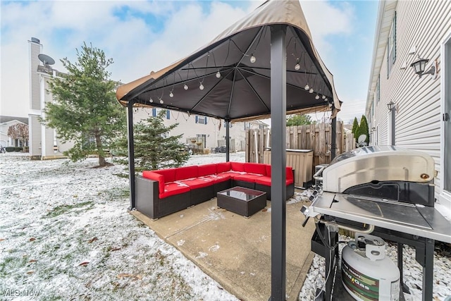 snow covered patio with outdoor lounge area