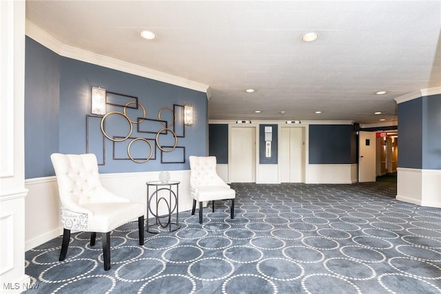 living area with dark colored carpet, crown molding, and elevator