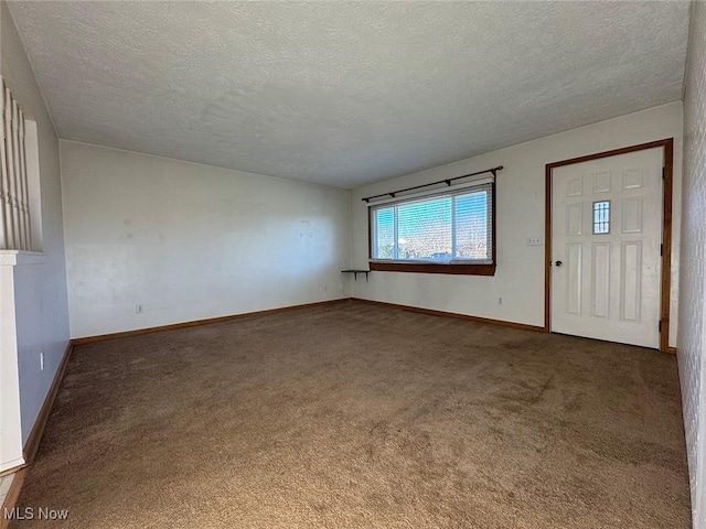 carpeted entryway with a textured ceiling