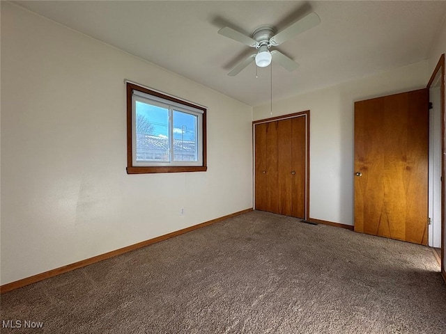 unfurnished bedroom featuring carpet flooring, ceiling fan, and a closet