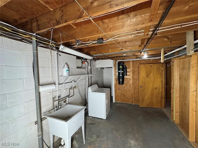 basement with washer / clothes dryer and sink