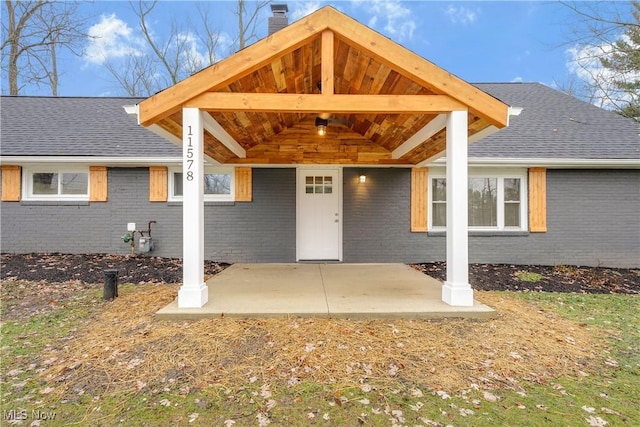 property entrance with a patio