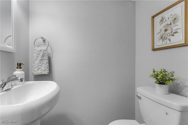 bathroom featuring sink and toilet