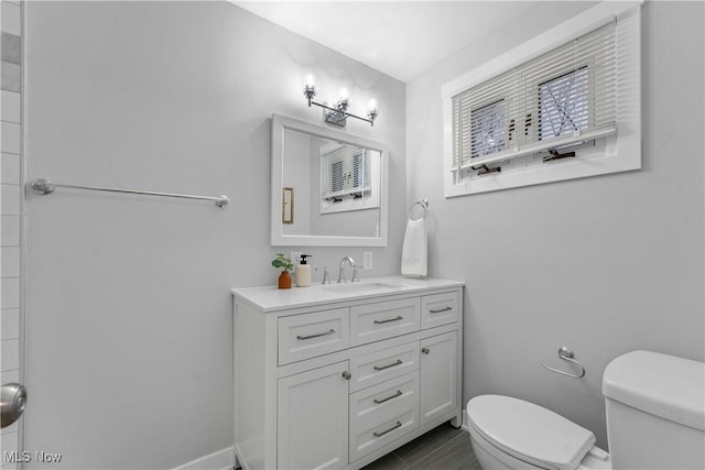 bathroom with vanity and toilet