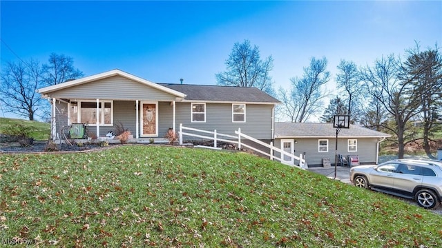 ranch-style home featuring a front yard and a porch