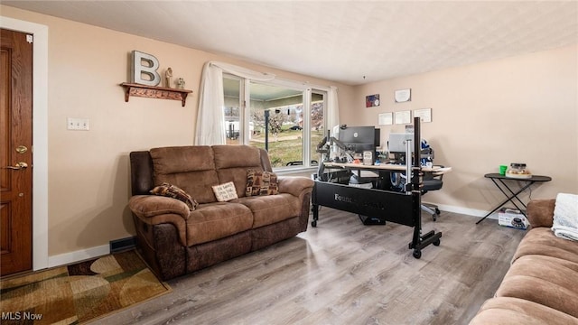 office space with wood-type flooring