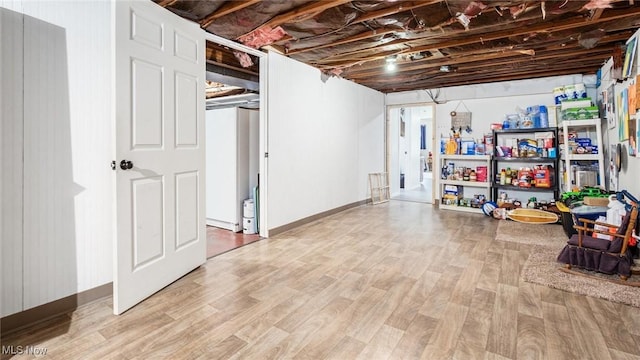 basement featuring light wood-type flooring