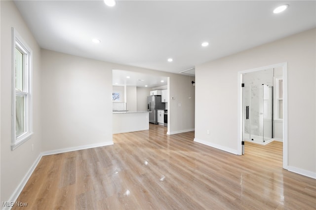 unfurnished living room with light hardwood / wood-style flooring