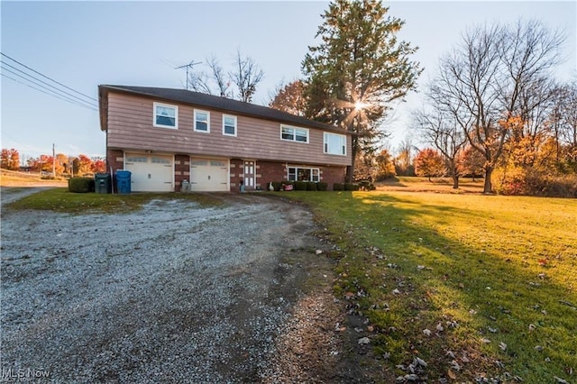 view of front facade with a front yard and a garage