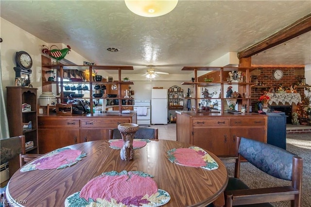 dining room with ceiling fan and a textured ceiling