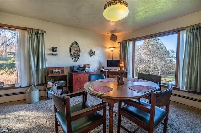 carpeted dining area featuring plenty of natural light