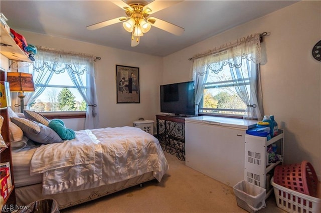 bedroom with ceiling fan and carpet