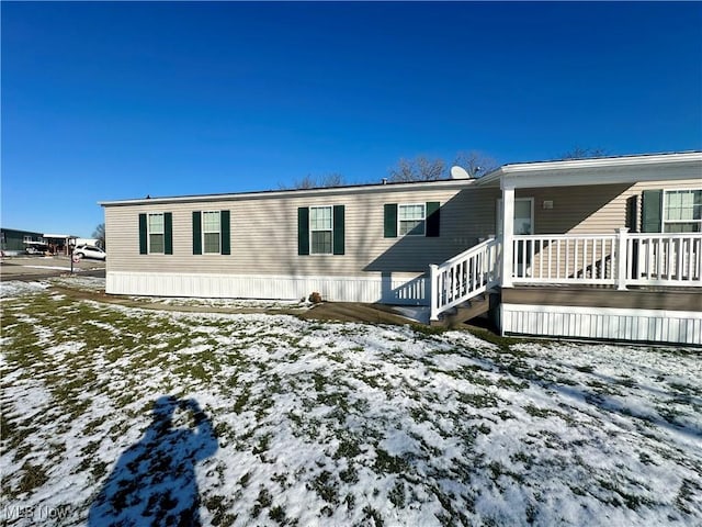 view of snow covered house