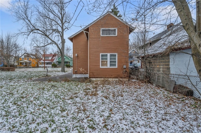 view of snow covered house