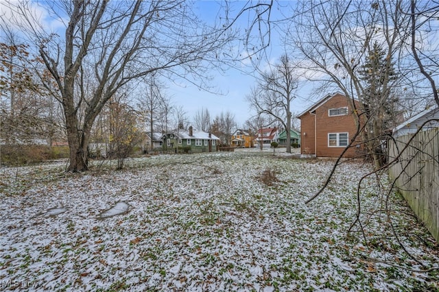 view of yard layered in snow