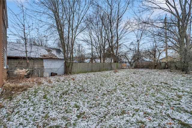 view of yard layered in snow