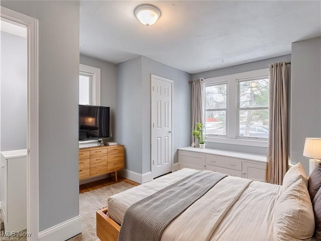 bedroom featuring baseboards