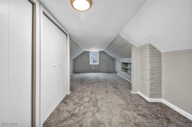 additional living space with lofted ceiling and carpet floors