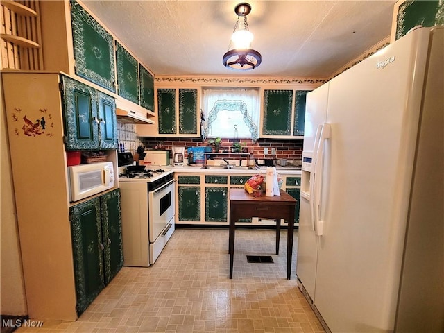 kitchen with decorative backsplash, white appliances, and sink