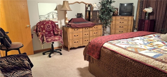 bedroom featuring light carpet