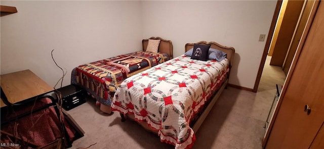 bedroom featuring light carpet