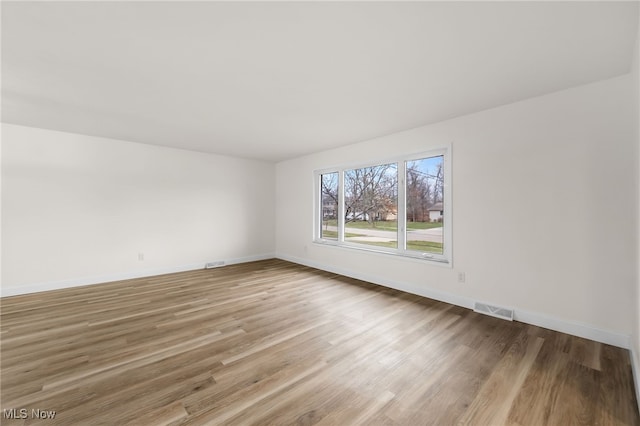 empty room featuring wood-type flooring