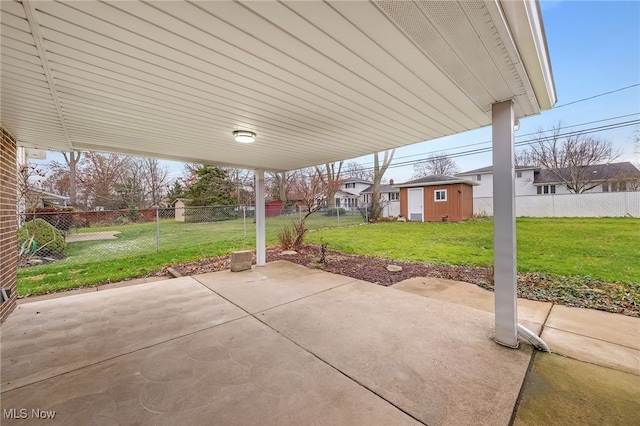 view of patio featuring a shed