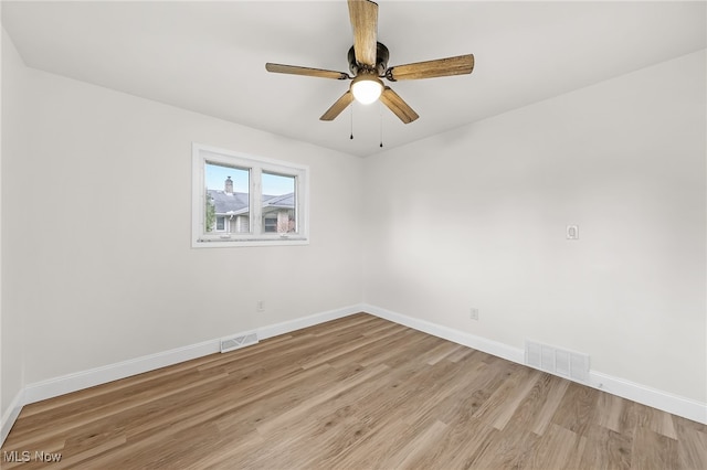 empty room with light hardwood / wood-style floors and ceiling fan