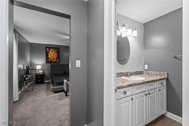 bathroom with baseboards and vanity