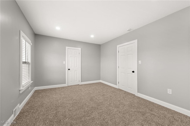 spare room featuring carpet flooring