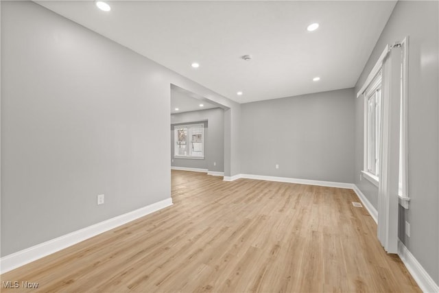 spare room with light hardwood / wood-style floors