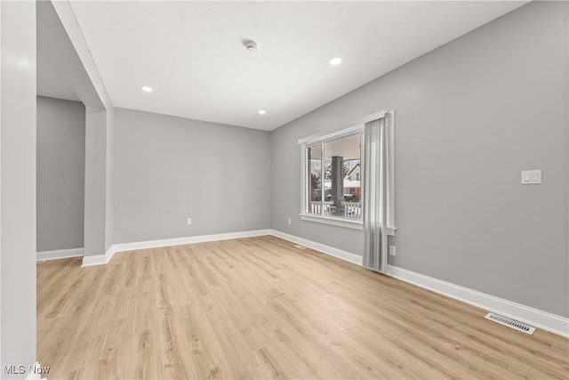 spare room featuring light hardwood / wood-style flooring